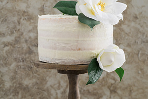 Naked wedding cake featuring wedding cake, naked cake, and flowers