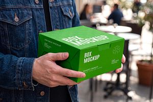Hand Holding Box Packaging Mockup, a Packaging Mockup by graphypix