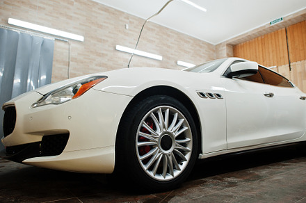 White new luxury sport car in detailing garage., a Transportation Photo by AS photostudio