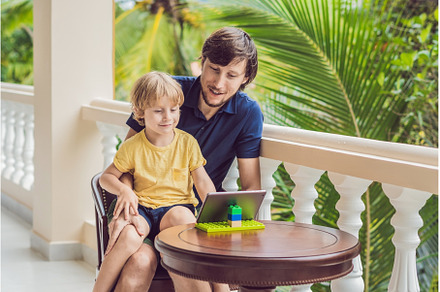 father and son in tropics talking, a Person Photo by Elizaveta Galitskaya