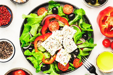 Greek salad with feta cheese, olives, cherry tomato, paprika, cu, a Food & Drink Photo by 5PH