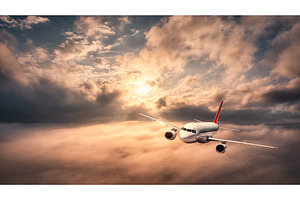 Airplane is flying above the clouds, a Transportation Photo by den-belitsky
