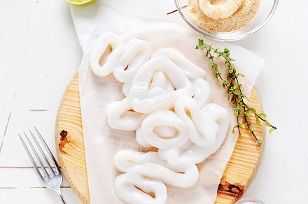 Raw squid rings with lime containing squid, raw, and rings, a Food & Drink Photo by IriGri
