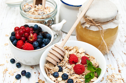 Healthy breakfast containing breakfast, muesli, and honey, a Food & Drink Photo by Olena Rudo