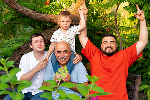 Joyful family cheering together with, a Person Photo by Elena Vagengeim