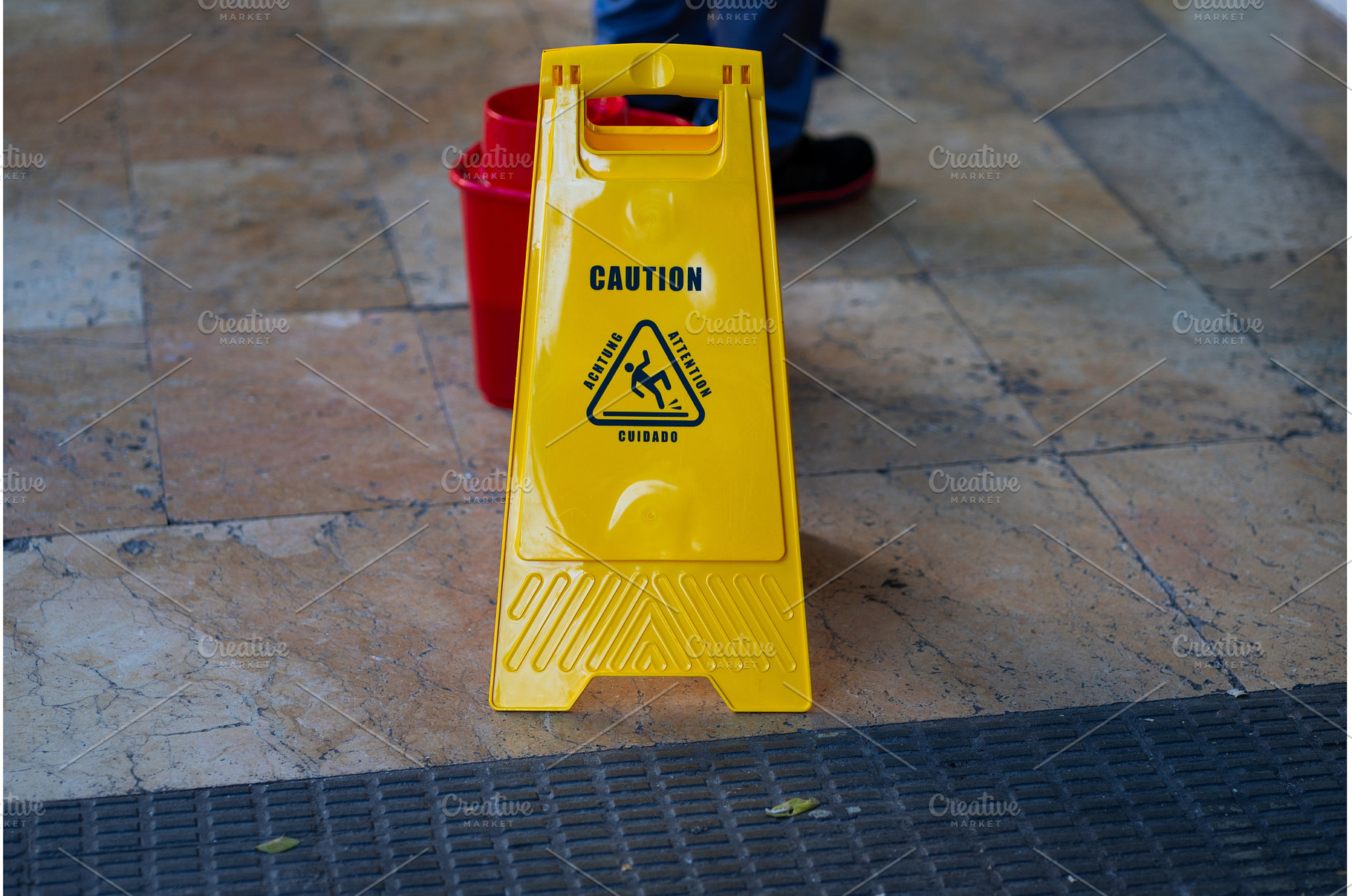 Yellow plastic wet floor caution, an Industrial Photo by volodymyrshtun13795