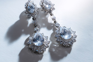Dazzling diamond earrings with brilliant gemstones hanging, crea, a Photo by Studio ANNA