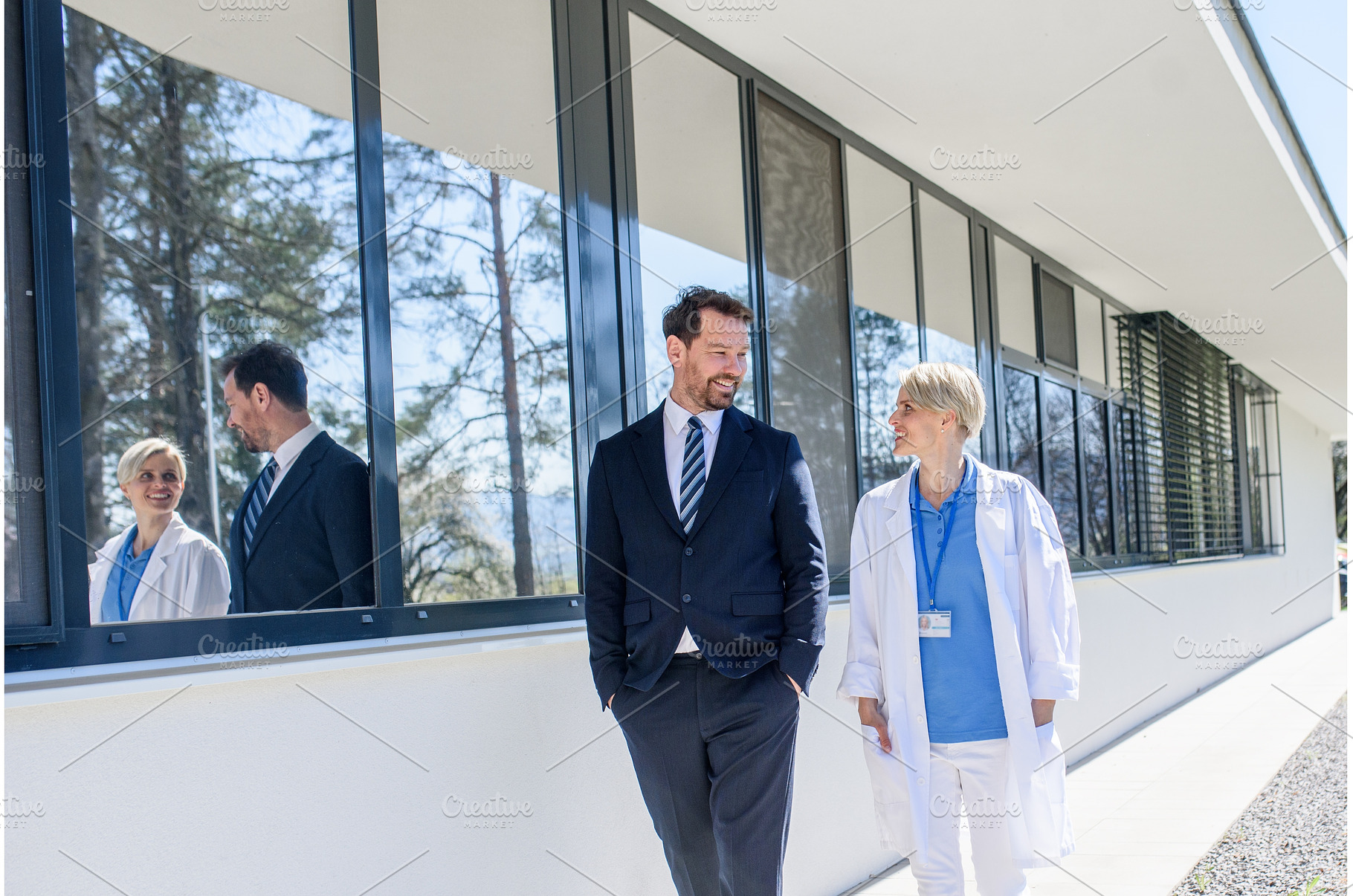Doctor and hospital administrator, a Health & Medical Photo by HalfPoint