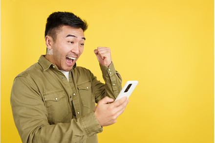 Excited chinese man celebrating, a Person Photo by Iván Moreno STOCK PHOTO