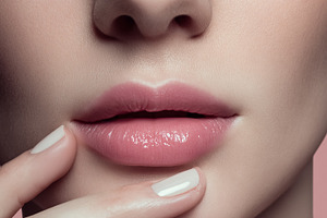 Applying pink lip gloss for glossy lips on beautiful female face, a Beauty & Fashion Photo by Studio ANNA