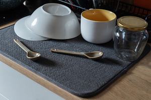 Everyday kitchen still life with washed dishes drying on a gray, an Industrial Photo by MDBildes