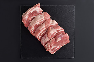 Fresh raw pork shoulder butt slices featuring pork, meat, and shoulder