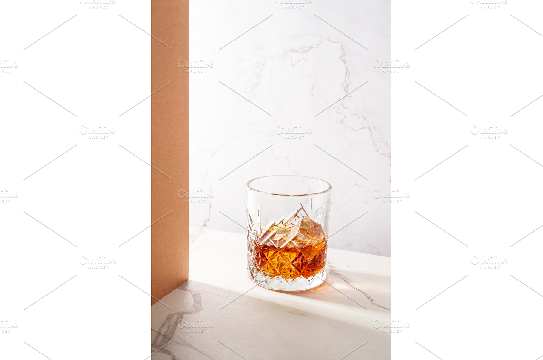 Whiskey with ice cube in the glass, a Food & Drink Photo by Nadia-nb