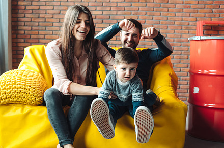 Young family having fun featuring family, mom, and child, a Person Photo by Tekso