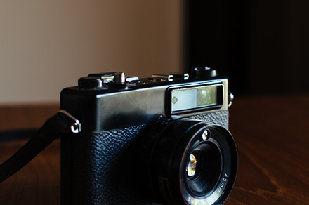 Vintage camera on a wooden table, a Technology Photo by OSORIOartist