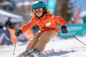 Child Skiing Downhill in Orange Jacket, a Sports & Recreation Photo by AlyaAnd