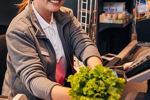 Cheerful woman cashier, a Person Photo by Artem Varnitsin