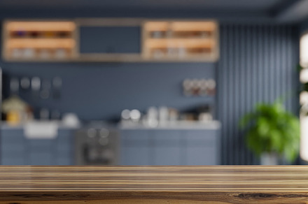 Wooden table top on blur kitchen, an Architecture Photo by vanitjan