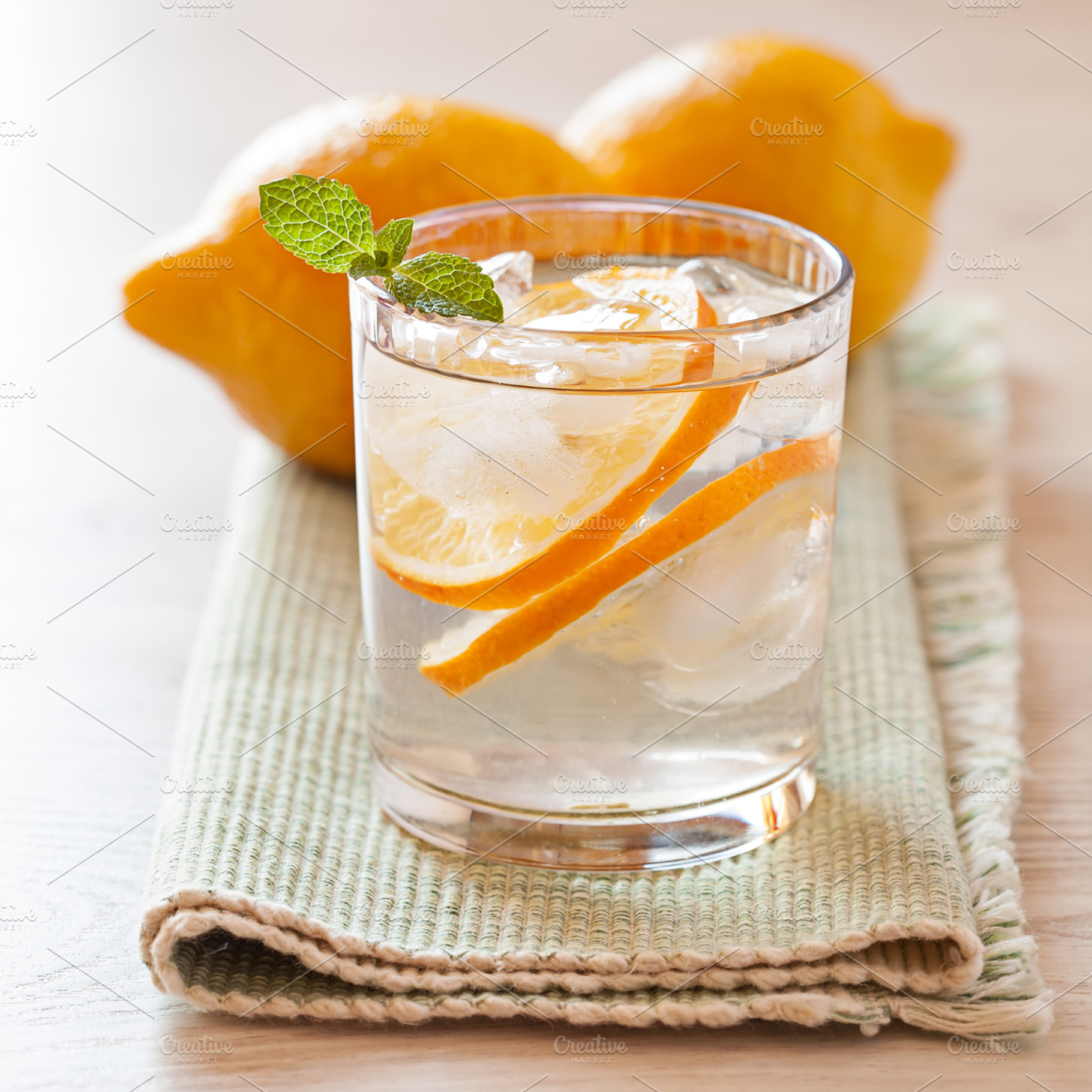 Fresh cold lemonade with lemons containing background, beverage, and citrus