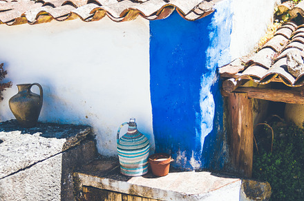 Rustic house wall with pottery