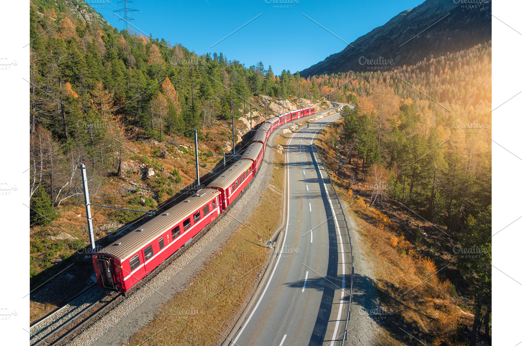 Aerial view of red train, river in, a Transportation Photo by den-belitsky