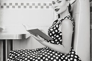 Cute young girl in cafe. Retro