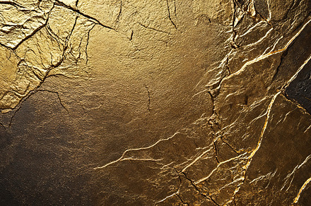 Textured gold background with deep black highlights., a Background Photo by OSORIOartist