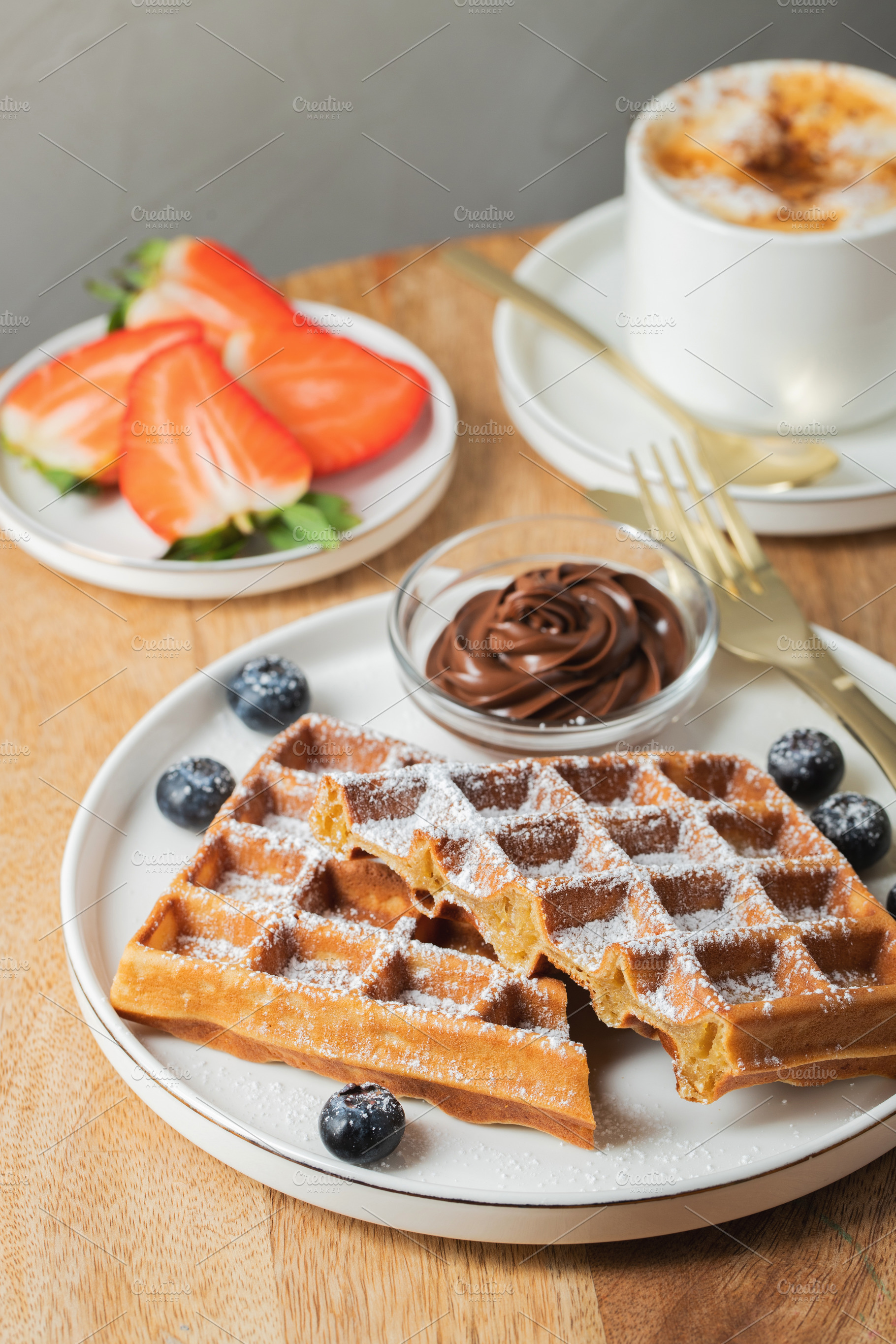Belgium waffles Homemade waffles with strawberries, a Food & Drink Photo by Budarinphoto