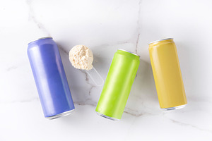 Clear whey drink, in colorful tin cans bottles, a Food & Drink Photo by Rimma