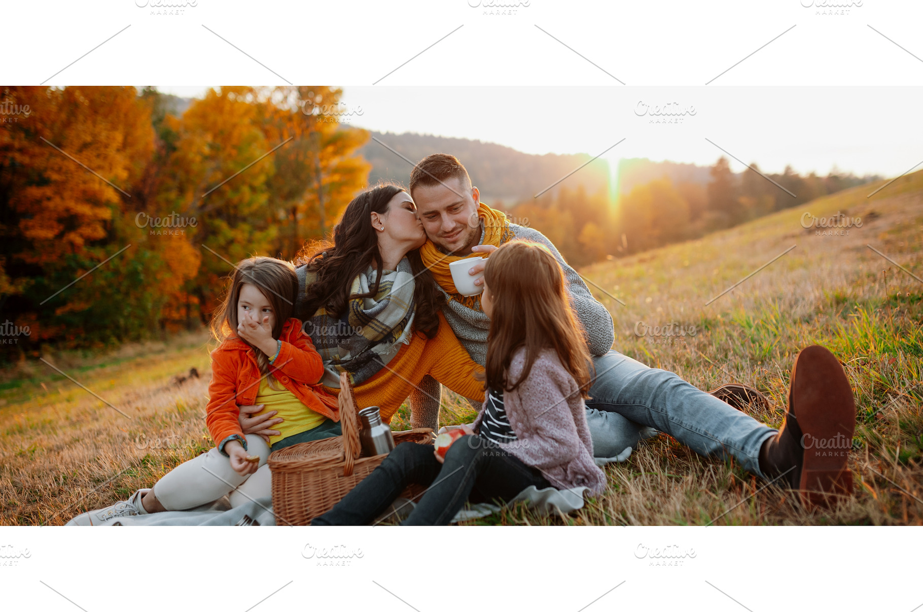 Parents with young children sitting, a Person Photo by HalfPoint