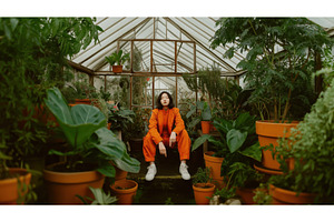 Asian woman in an orange outfit, a Person Photo by Sergey Kotenev