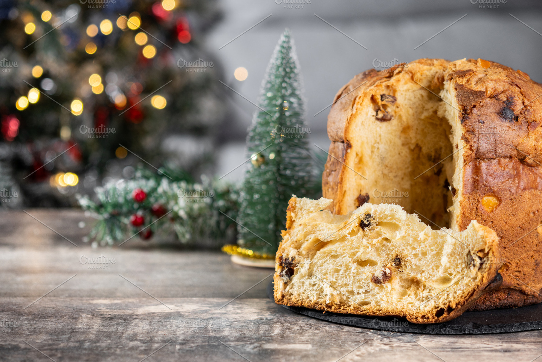 Traditional Italian Panettone on wooden table and christmas tree, a Food & Drink Photo by etorres69