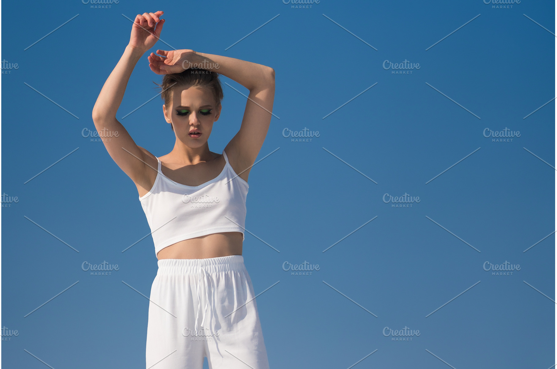 Fashion model with her hands raised, a Beauty & Fashion Photo by Alexander-Piragis