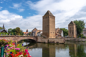 Covered Bridges towers and Ill river in Strasbourg France, an Architecture Photo by GoodGoods