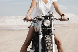 Female on custom built cafe racer motorcycle containing background, woman, a Transportation Photo by Aliaksei Kaponia