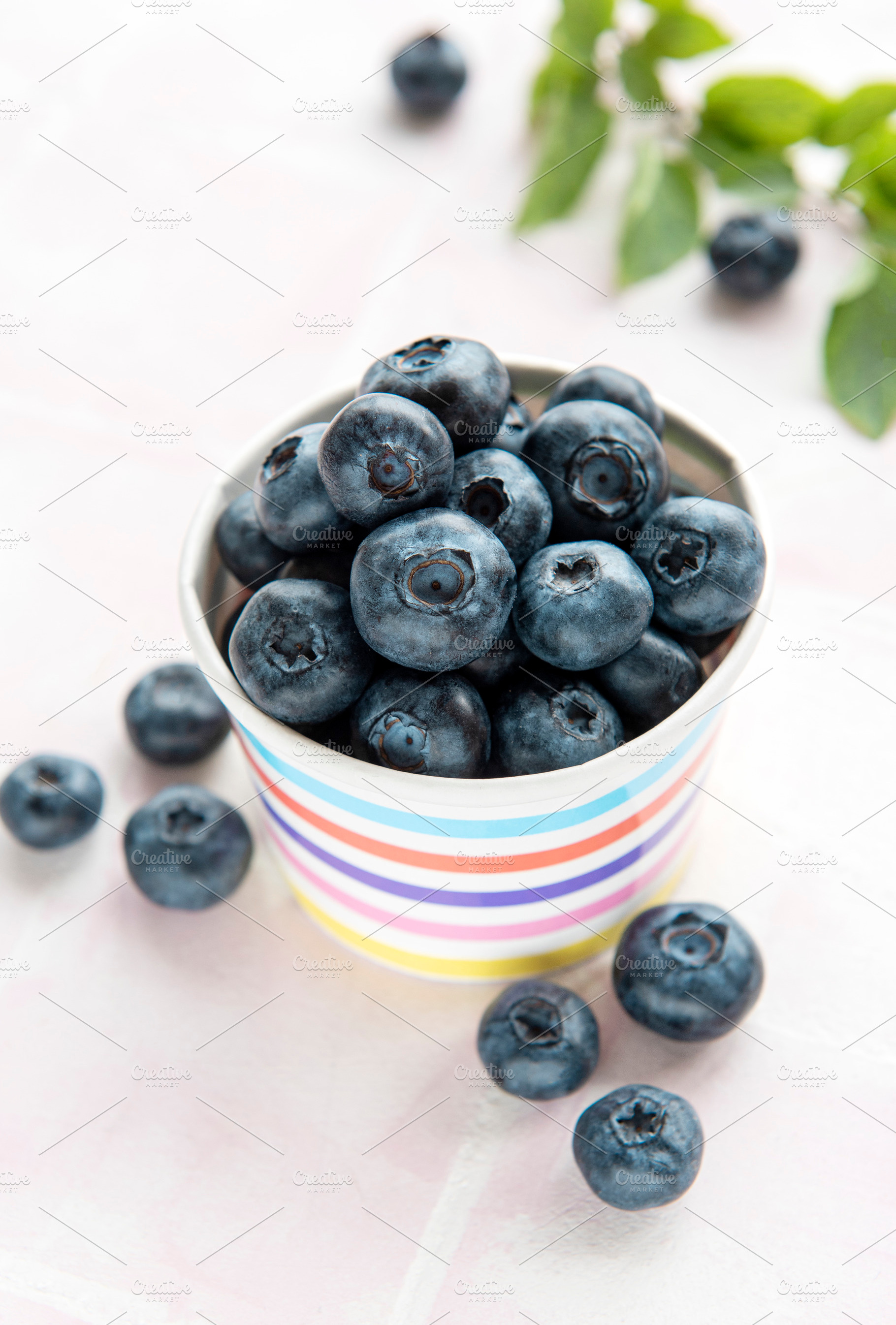 Blueberries on tile background, a Food & Drink Photo by Olena Rudo