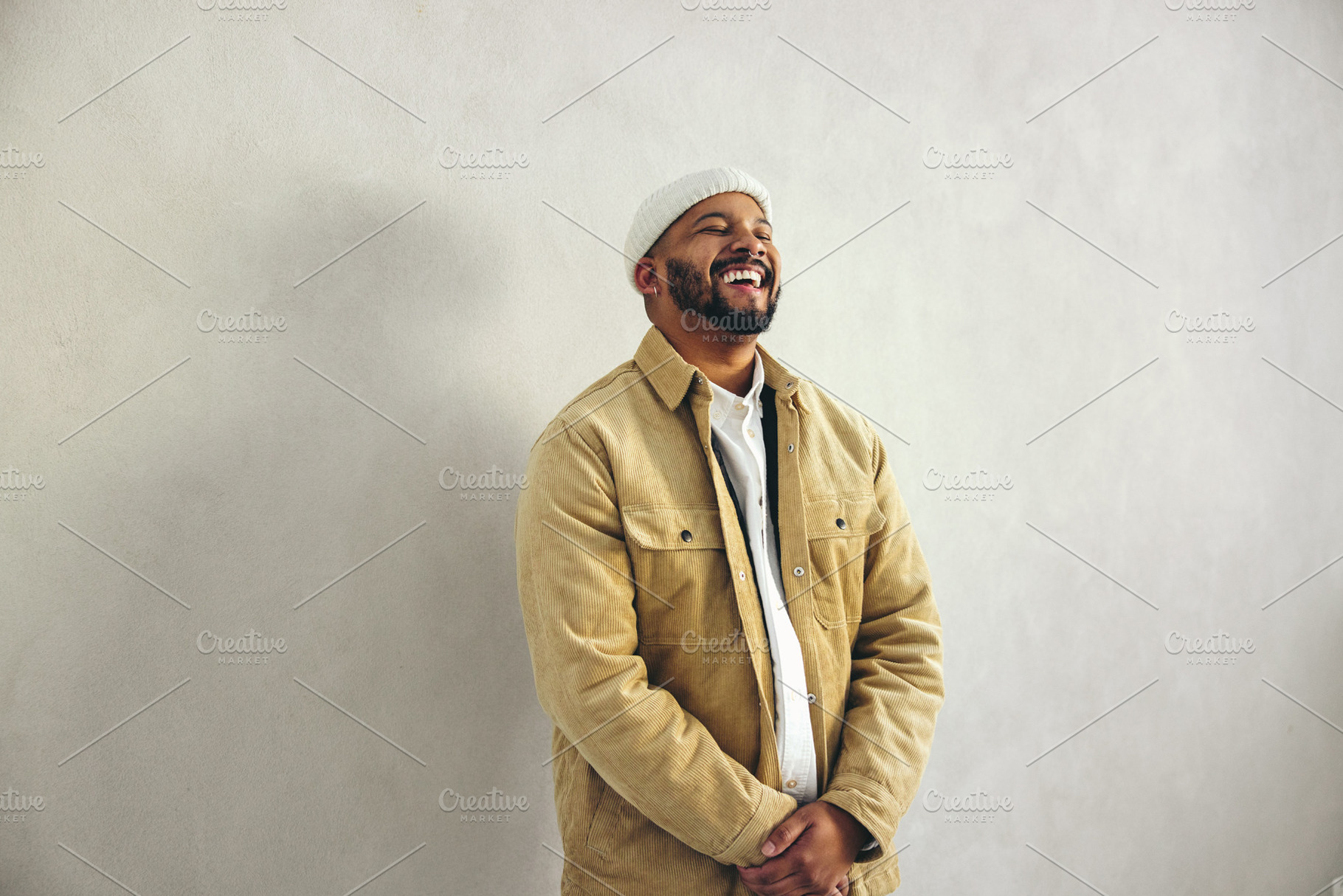 Modern businessman laughing happily in an office, a Person Photo by Jacob Lund