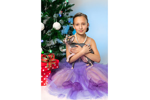 Girl in purple dress holding, an Animal Photo by Alexander-Piragis