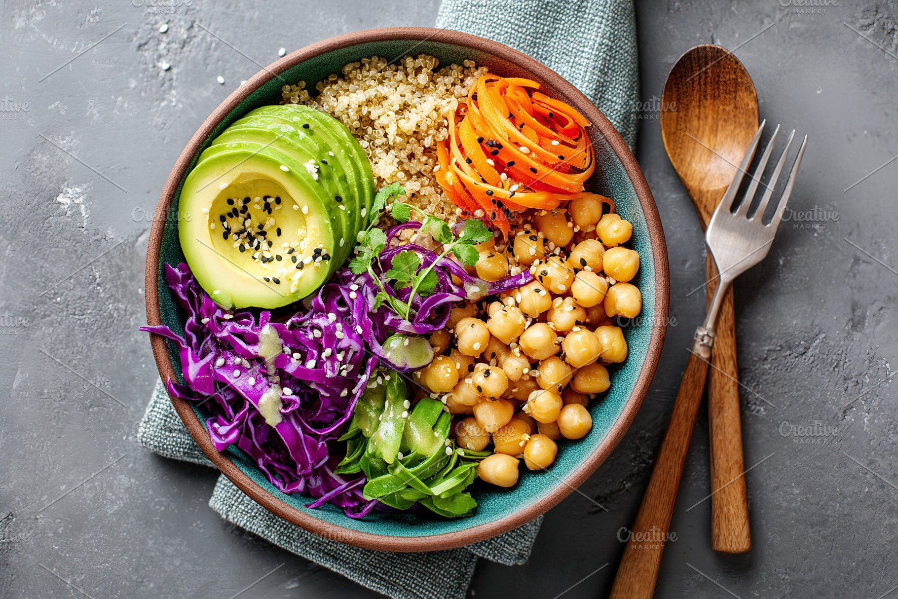 Delicious vegan bowl with quinoa, avocado, and purple cabbage served on a textu, a Food & Drink Photo by AlyaAnd