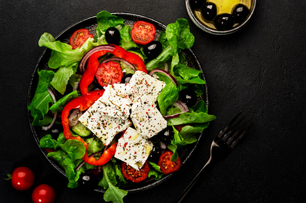 Greek salad with feta cheese, olives, cherry tomato, paprika, cu, a Food & Drink Photo by 5PH