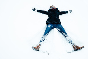Woman having fun in the snow