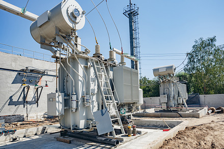 High-voltage substation on blue sky background
