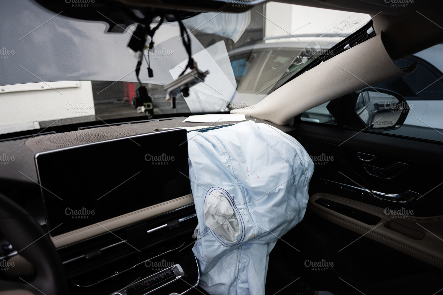 Interior view of a car with deployed airbag after an accident, a Transportation Photo by AS photostudio