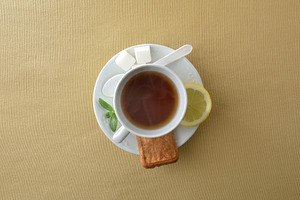 Teacup with ingredients isolated in the center on brown tableclo, a Food & Drink Photo by Davizro's Market