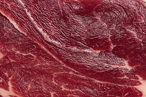Detailed close up of fresh raw red meat texture with white fat m, a Food & Drink Photo by ndanko