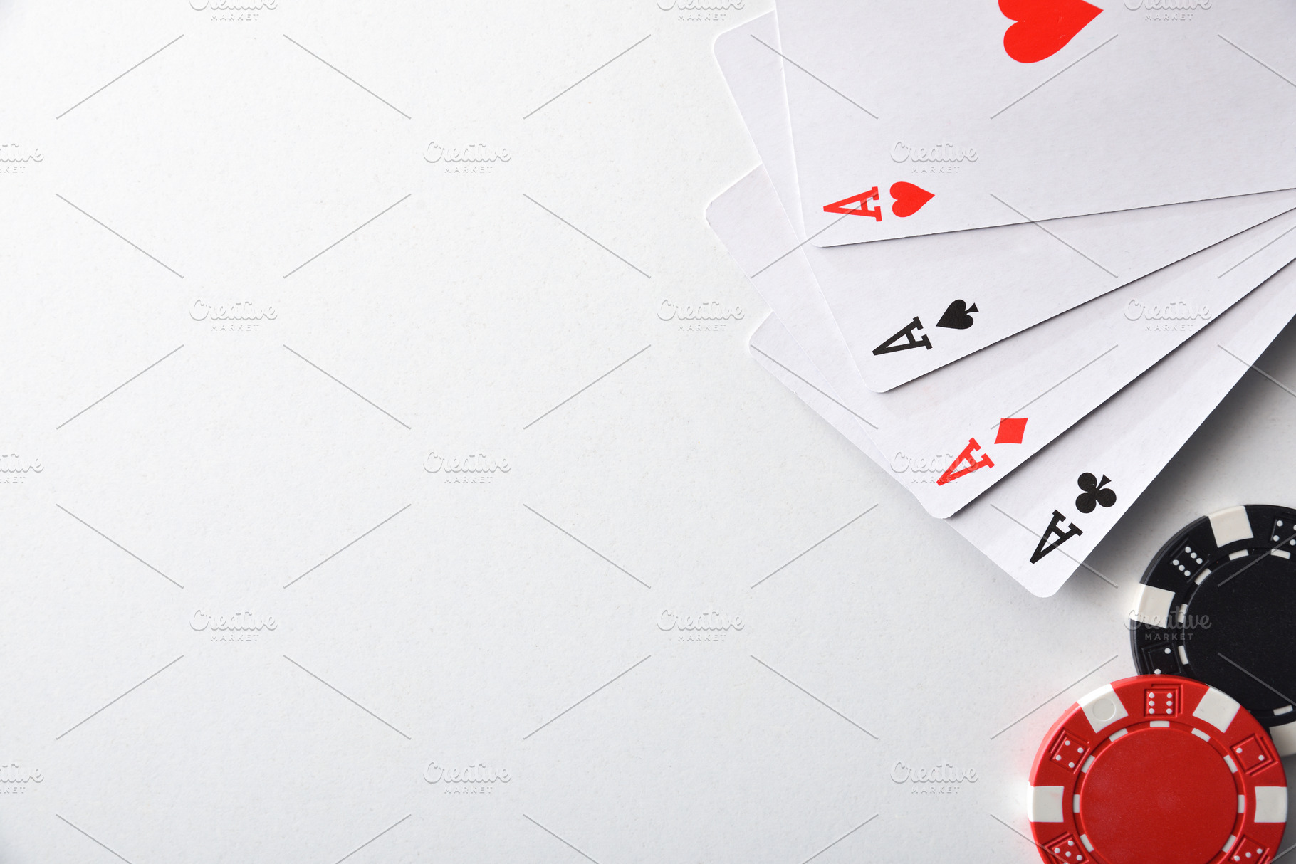 Aces and chips for betting isolated on white table, an Arts & Entertainment Photo by Davizro's Market