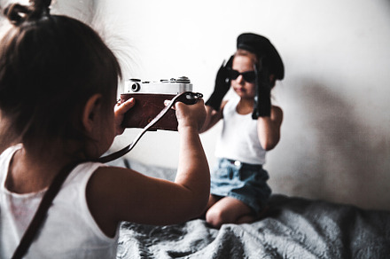 Two little girls taking a picture