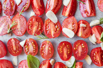 Fresh tomato slices with herbs, a Food & Drink Photo by Olena Rudo