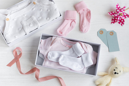 Box with baby stuff and accessories for newborn on white wooden, a Beauty & Fashion Photo by Olena Rudo