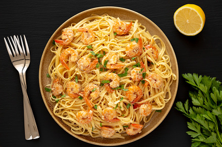 Baked Shrimp Scampi Linguine Pasta with Parsley on a Plate, top, a Food & Drink Photo by LiudmylaChuhunova